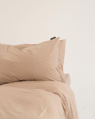 Earth-tone duvet cover set by The T‑Shirt Bed Co., natural-coloured cotton with soft, crease-free finish