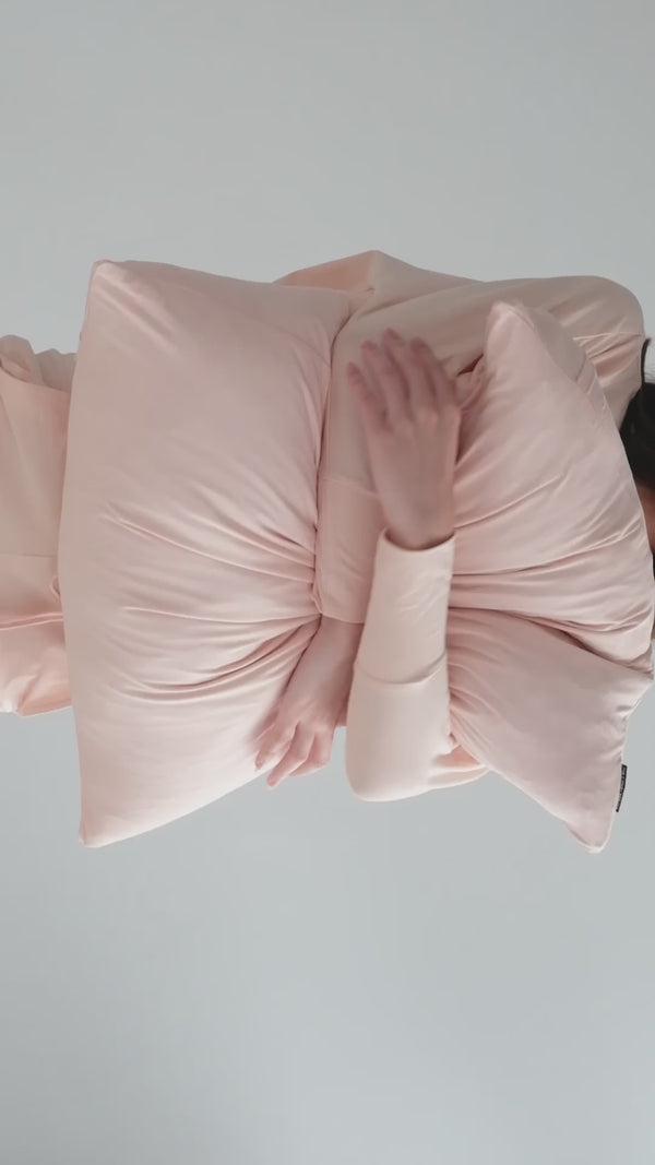 model in rosewater loungewear with rosewater scatter cushion