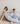 couple in matching T-Shirt Bed Co. earth loungewear and hydrangea luxury bedding