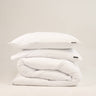 Crisp white duvet cover set in Scandinavian White, breathable jersey-knit cotton by The T‑Shirt Bed Co.